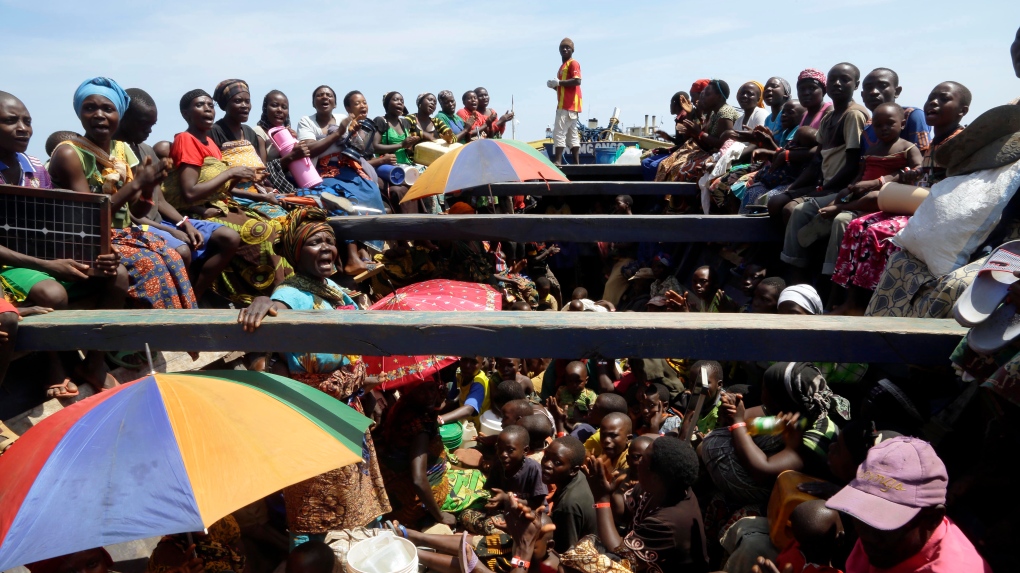 Burundi refugees sing as they are relocated