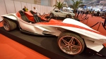 The Sbarro Triple car is shown at the Motor Show in the city of Essen, Germany, Wednesday, Dec. 2, 2015. The car by Italian designer Franco Sbarro has 3 seats and an engine with 400 horse powers. (AP / Martin Meissner)