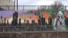 Part of a Toronto mural is seen in a screen shot taken from YouTube video. (Paul Salvatori / YouTube)