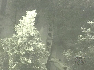 The wreckage of the single-engine plane is seen on a remote hillside near Buckland, Que., on Tuesday, Jan. 6, 2009.