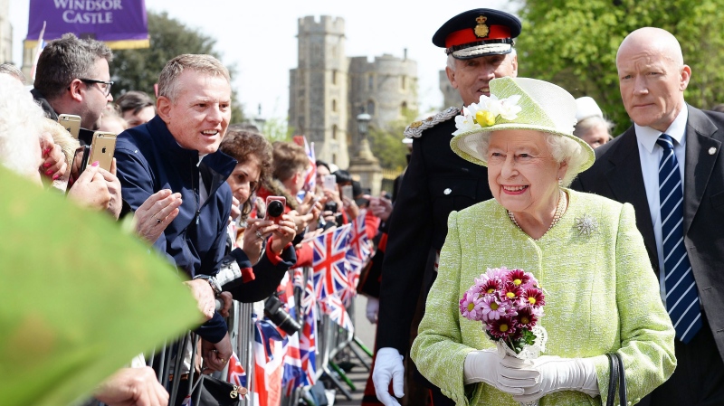 Queen Elizabeth II meets well wishers during a walkabout close to Windsor Castle as she celebrates her 90th birthday, in Berkshire, England, Thursday, April 21, 2016. (John Stillwell/Pool Photo via AP) 