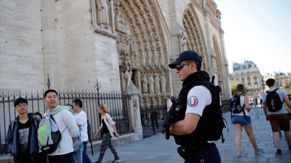 Police patrol Notre Dame cathedral in Paris