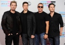 Chad Kroeger, Daniel Adair, Mike Kroeger, and Ryan Peake of the band Nickelback arrives at the 39th Annual American Music Awards on Sunday, Nov. 20, 2011 in Los Angeles. (AP Photo/Chris Pizzello)