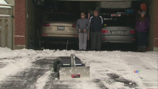Father-son team build remote control robot to shovel their driveway | CTV  News