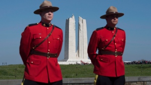 RCMP officers stand at the entrance to the Vimy Memorial before ceremonies to mark the 100th anniversary of the battle, north of Arras, France, Sunday, April 9, 2017. (THE CANADIAN PRESS / Adrian Wyld)