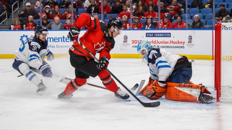 Canda's Boris Katchouk scores past Finland's Ukko-Pekka Luukkonen, right, as Kasper Kotkansalo, left, looks on during the first period of IIHF World Junior Championship preliminary round hockey action in Buffalo, N.Y., Tuesday, December 26, 2017. THE CANADIAN PRESS/Mark Blinch