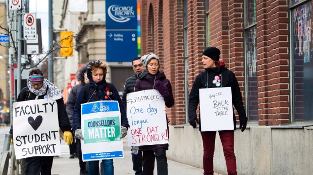 Teachers and faculty staff of the Ontario Public Service Employees Union walk the picket line at George Brown College in Toronto on November 16, 2017. College faculty in Ontario head back to their schools today, after a five-week strike was ended over the weekend with back-to-work legislation. The 12,000 professors, instructors, counsellors and librarians who had been on strike since Oct. 15 will return to work today to prepare for students' return on Tuesday. THE CANADIAN PRESS/Nathan Denette