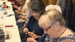 Seniors knitting for third world children