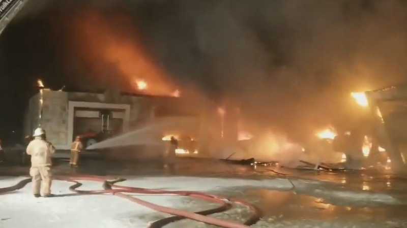 In this image from video crews battle a barn fire in Norfolk County, Ont. on Wednesday, Dec. 12, 2018. (@OPP_WR / Twitter)