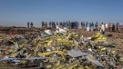 Wreckage is piled at the crash scene of an Ethiopian Airlines flight crash near Bishoftu, or Debre Zeit, south of Addis Ababa, Ethiopia, Monday, March 11, 2019. A spokesman says Ethiopian Airlines has grounded all its Boeing 737 Max 8 aircraft as a safety precaution, following the crash of one of its planes in which 157 people are known to have died. (AP Photo/Mulugeta Ayene)