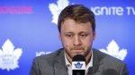Toronto Maple Leafs defenceman Morgan Rielly looks down during a press . THE CANADIAN PRESS/Cole Burston