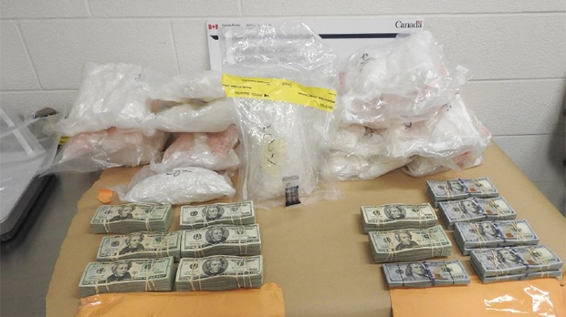 Suspected methamphetamine and U.S. currency seized from a transport truck at the Blue Water Bridge in Point Edward, Ont. on May 2, 2019 is seen in this image provided by the RCMP.