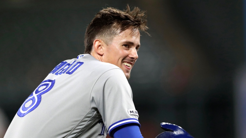Toronto Blue Jays' Cavan Biggio looks toward the dugout after hitting a triple to complete the cycle, off Baltimore Orioles relief pitcher Mychal Givens during the ninth inning of a baseball game Tuesday, Sept. 17, 2019, in Baltimore. The Blue Jays won 8-5. (AP Photo/Julio Cortez)