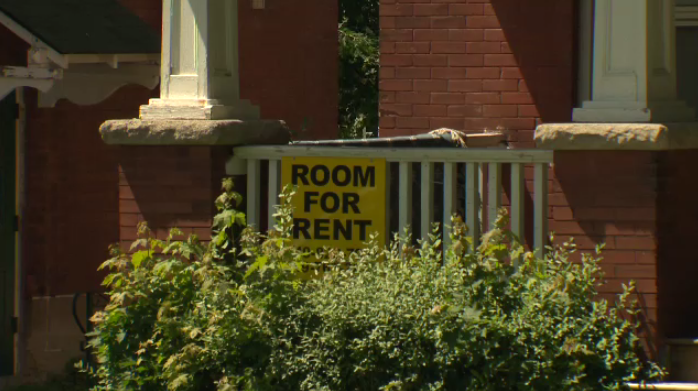 A Room For Rent sign at a house