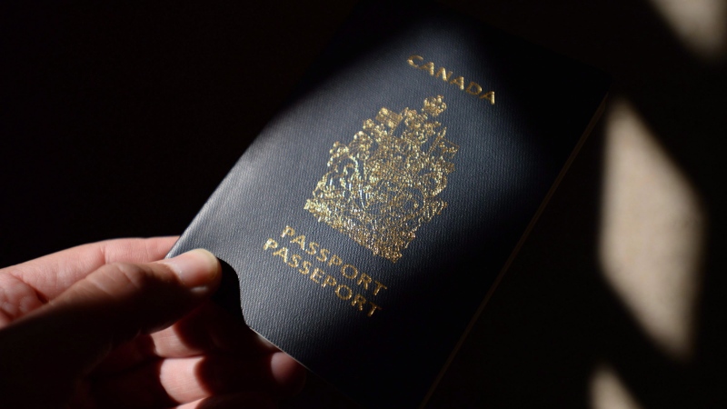 A Canadian passport is displayed in Ottawa on Thursday, July 23, 2015. THE CANADIAN PRESS/Sean Kilpatrick