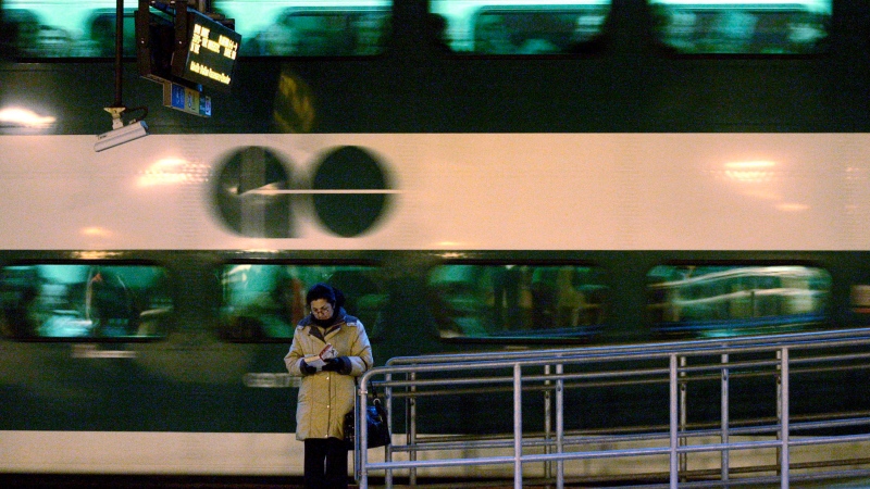 A woman reads a book as a GO commuter train pulls away from the platform at Toronto's Union Station, March 4, 2008. Friday June 24, 2011. THE CANADIAN PRESS/J.P. Moczulski