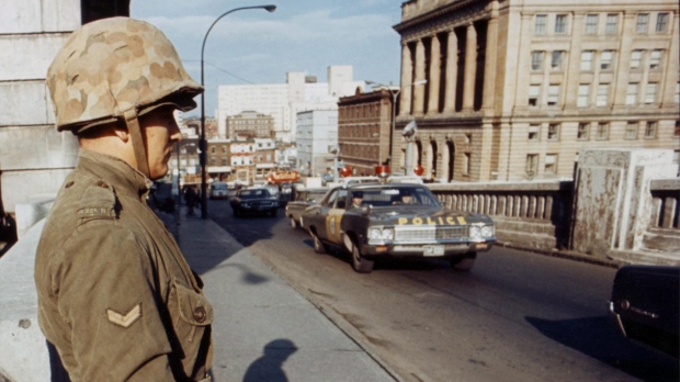 Soldiers of the Royal 22nd Regiment from Quebec City stand guard on one of the many bridges in Montreal after the War Measures Act was invoked on Oct. 16, 1970. (THE CANADIAN PRESS)