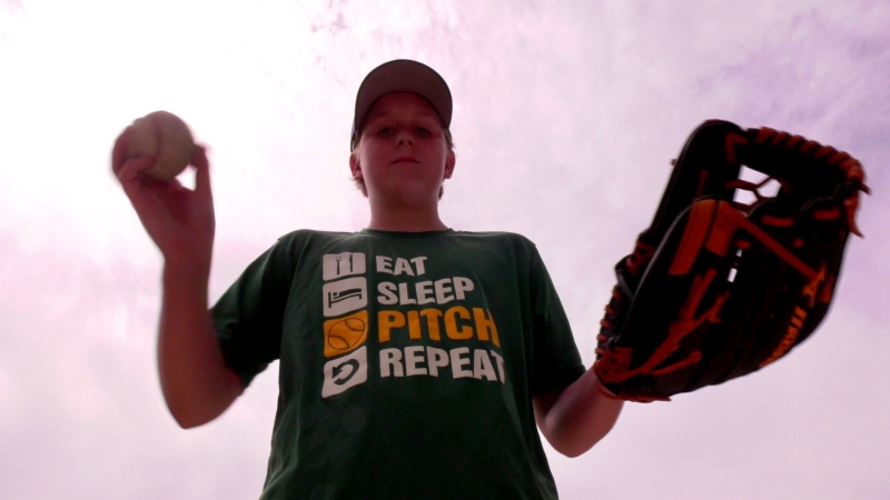 Mackay Jeffery, a South Windsor Canadiens baseball player, tosses the ball around on May 27, 2020. (Rich Garton / CTV Windsor)