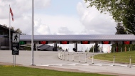 In this photo taken Sunday, May 17, 2020, a single lane remains heading into Canada from the U.S. at the Peace Arch border crossing in Blaine, Wash. (AP Photo/Elaine Thompson)