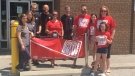 The Marsh family (right) presents $2500 to the Leukemia Bottle Drive at the Lorne Ave Beer Store location in London, Ont. on June 20, 2020. (Brent Lale/CTV London)