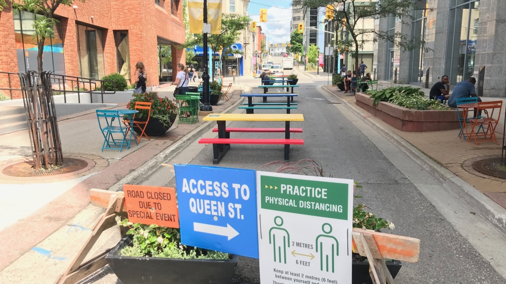 Picnic tables on a closed street downtown 