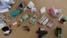 Drugs, cash and weapons seized on Friday, Sept. 11, 2020 are seen in this image released by the London Police Service.