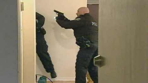 Ottawa police enter a building in this file image.