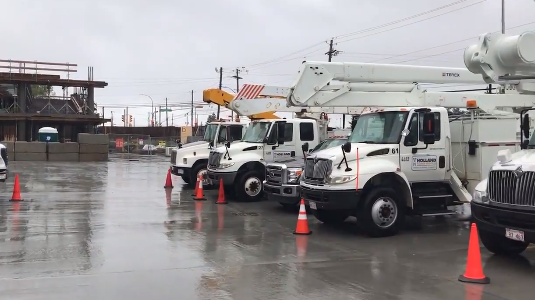 Power trucks from New Brunswick are seen on standby in Halifax in Sept, 22, 2020.