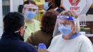 Nurses greet patients at a COVID-19 walk-in clinic in Montreal, on Tuesday, Sept. 29, 2020. (THE CANADIAN PRESS / Paul Chiasson)