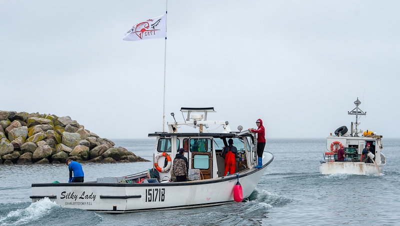 Indigenous lobster boats head from the harbour in Saulnierville, N.S. on Wednesday, Oct. 21, 2020. (THE CANADIAN PRESS /Andrew Vaughan)