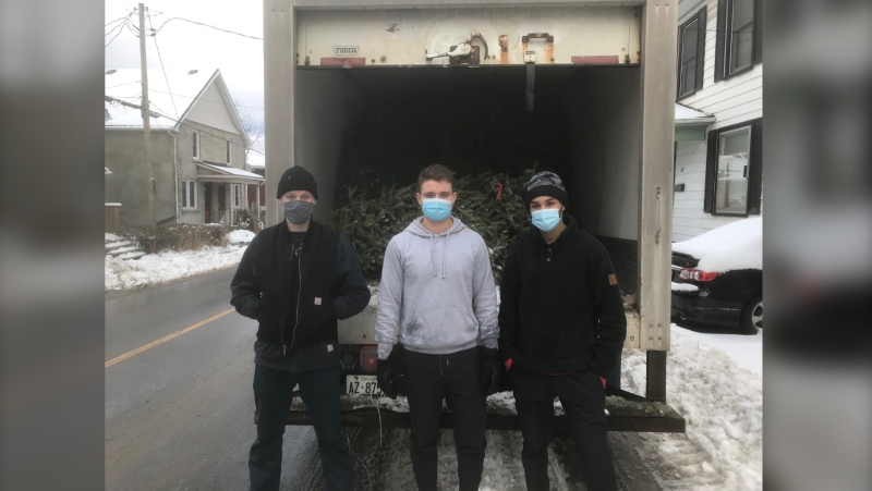 Max Emelifeonwu (right) and two volunteers are collecting 100 trees across the city of Kingston Saturday (Kimberley Johnson/CTV News Ottawa) 