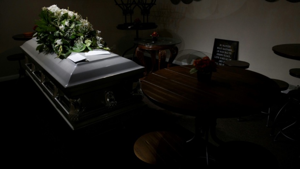 A casket stored in the break room of an overwhelming Louisiana funeral home