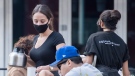 A server wears a face mask at a restaurant in Montreal, Saturday, September 26, 2020, as the COVID-19 pandemic continues in Canada and around the world. THE CANADIAN PRESS/Graham Hughes