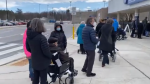 People lined up at the Nepean Sportsplex ahead of the mass vaccination site there opening Friday afternoon. People aged 90 and older are eligible to be vaccinated there. (Jeremie Charron/CTV News Ottawa)