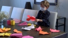 Marcus Brun, 7, shows off a few of the paper planes he's folded himself. Marcus says he's made hundreds of planes since picking up the skill last summer. (Chris Black/CTV Ottawa, March 15, 2021) 