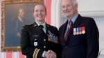 Governor General David Johnston presents Major Eleanor Taylor, from Antigonish, N.S. with the Meritorious Service Medal during a ceremony in Ottawa, Ont. Friday June 22, 2012. THE CANADIAN PRESS/Adrian Wyld