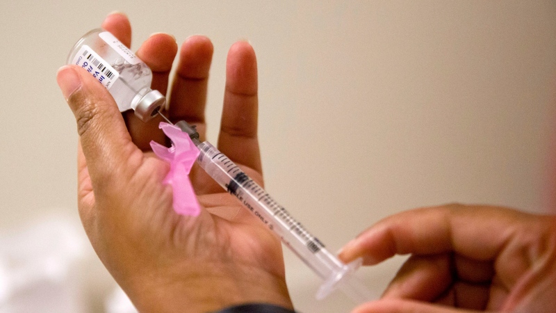 A nurse prepares a flu shot at the Salvation Army in Atlanta on Feb. 7, 2018. THE CANADIAN PRESS/AP, David Goldman