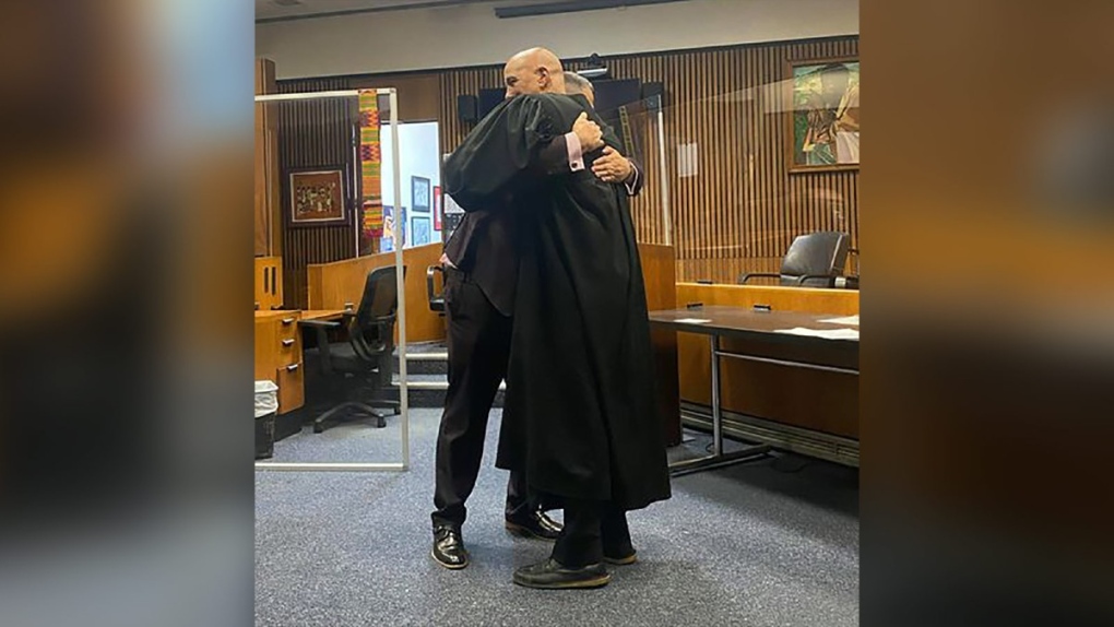 Edward Martell and Judge Bruce Morrow hugging