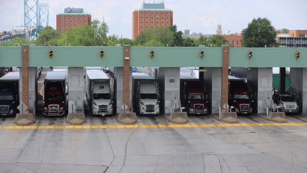Trucks line up at Canada Border Services Agency booths at the Ambassador Bridge in Windsor, Ont. on Wednesday, June 9, 2021. (Melanie Borrelli/CTV Windsor)