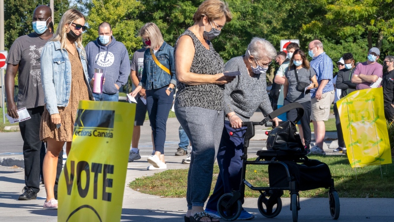 Voters line up at a polling station to vote in the Canadian federal election in Bowmanville, Ontario on Monday, September 20, 2021.THE CANADIAN PRESS/Frank Gunn 