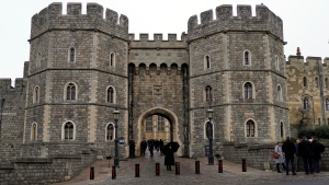 A general view of the King Henry VIII gate at Windsor castle guarded by armed police in Windsor, England Thursday, Jan. 6, 2022. (AP Photo/Alastair Grant) 