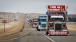 Anti-COVID-19 vaccine mandate demonstrators leave in a truck convoy after blocking the highway at the busy U.S. border crossing in Coutts, Alta., Feb. 15, 2022.THE CANADIAN PRESS/Jeff McIntosh