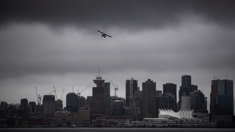 A seaplane takes off from the harbour under low cloud above the downtown skyline, in Vancouver, Thursday, Aug. 6, 2020. (Darryl Dyck / THE CANADIAN PRESS)