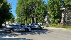 Winnipeg police block all lanes at Salter Street and Mountain Avenue on June 17, 2022. (Source: Zach Kitchen/ CTV News Winnipeg)