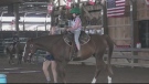 A young girl rides a horse at the Lazee G Ranch in Windsor, Ont. on July 22, 2022. (Bob Bellacicco/CTV News Windsor)
