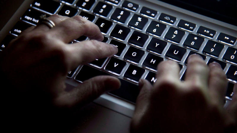 Hands type on a keyboard in North Vancouver, B.C., on Wednesday, December, 19, 2012. THE CANADIAN PRESS/Jonathan Hayward