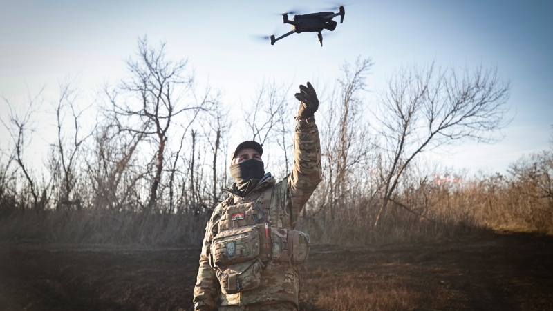 A Ukrainian serviceman flies a drone during an operation against Russian positions at an undisclosed location in the Donetsk region, Ukraine, Sunday, Dec. 4, 2022. (AP Photo/Roman Chop)