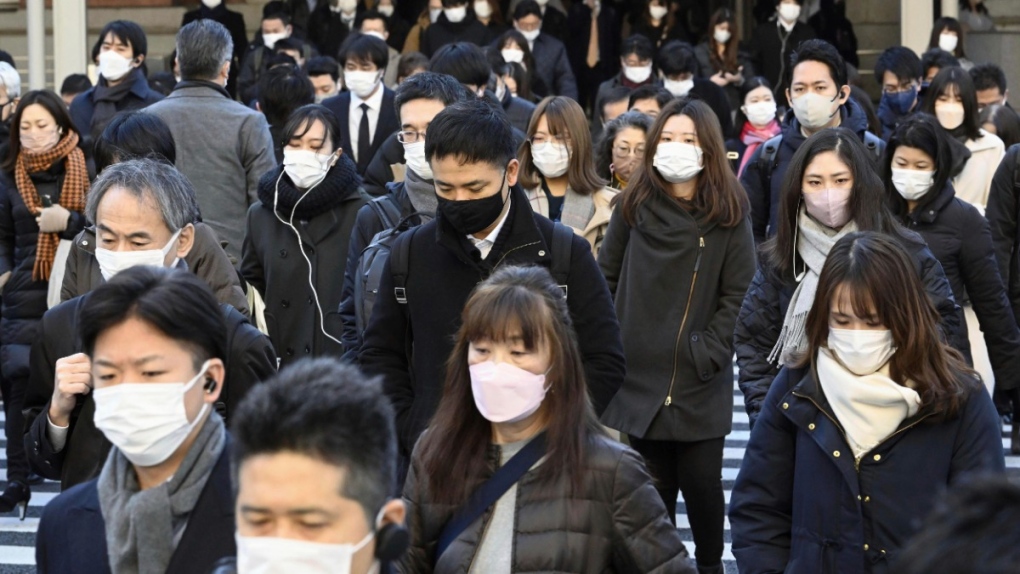 Commuters wear masks in Tokyo, Japan