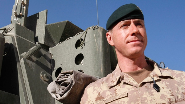 Brig. Gen. Daniel Menard, commander of Canada's Task Force Afghanistan, stands by a Light Armored Vehicle (LAV) in Kandahar Province, southern Afghanistan, Saturday, Jan. 30, 2010. (AP / Kirsty Wigglesworth)