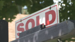 A real estate sign advertising a sold listing is shown in an undated file photo. 